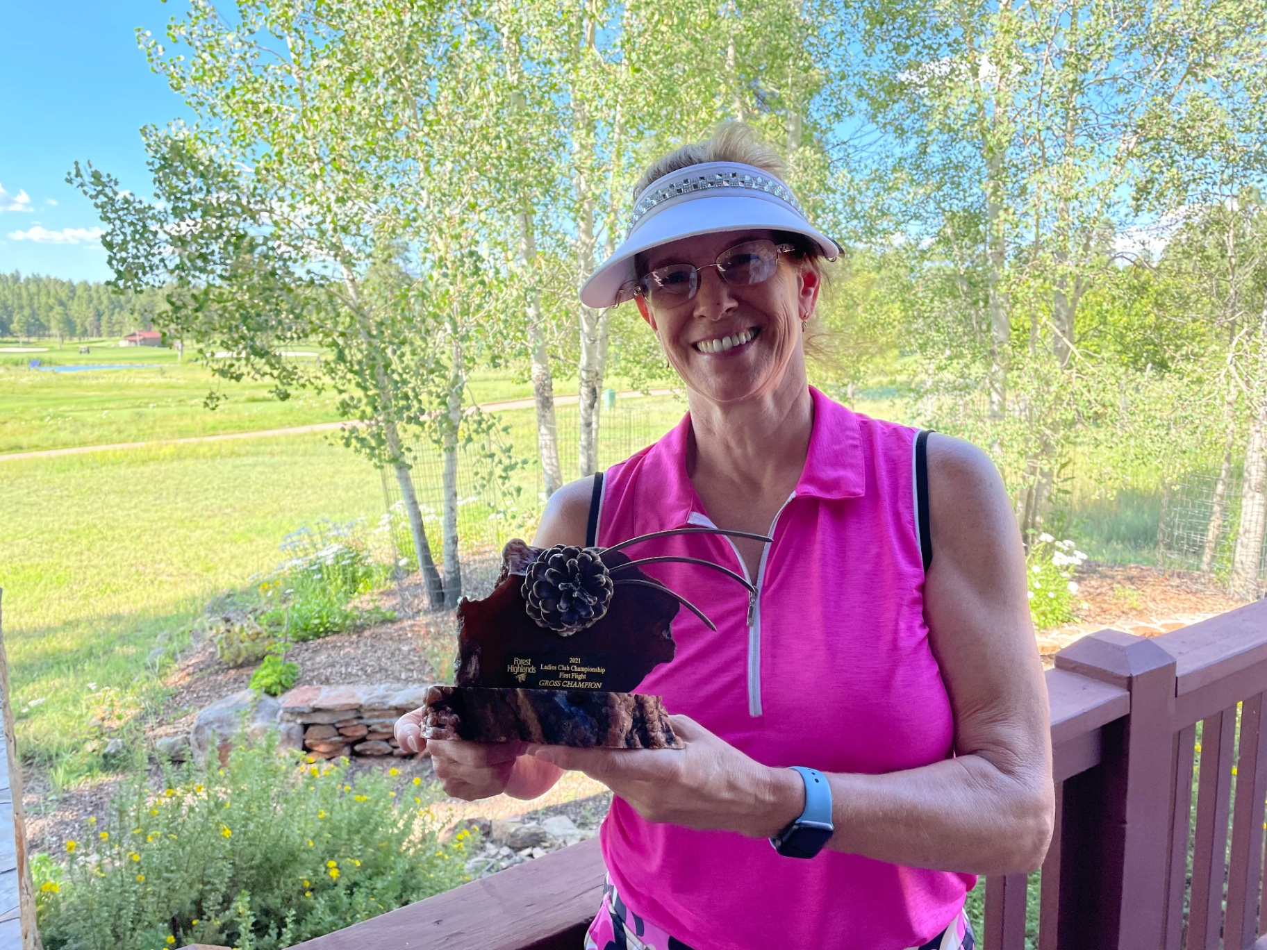 Karen with her golf tournament trophy